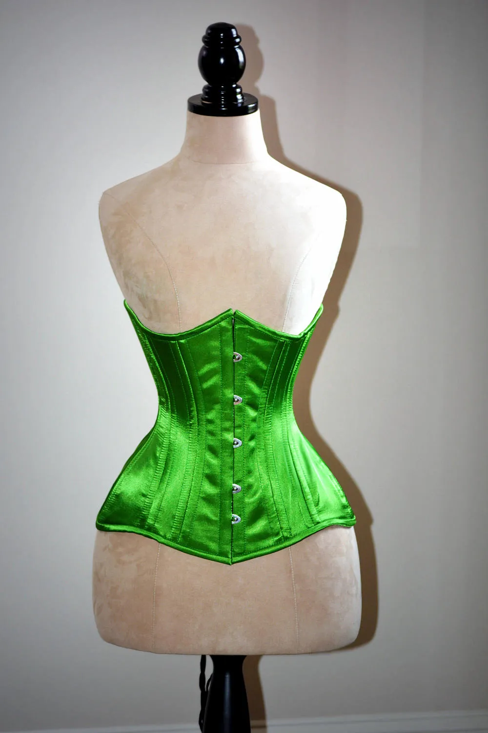 Real double row steel boned underbust corset from satin in a fashionable green grass summer color.